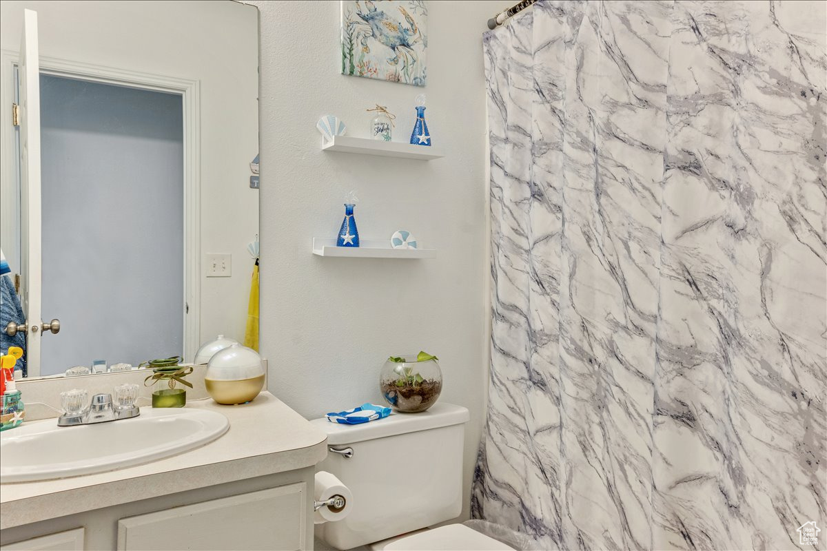 Bathroom featuring vanity and toilet