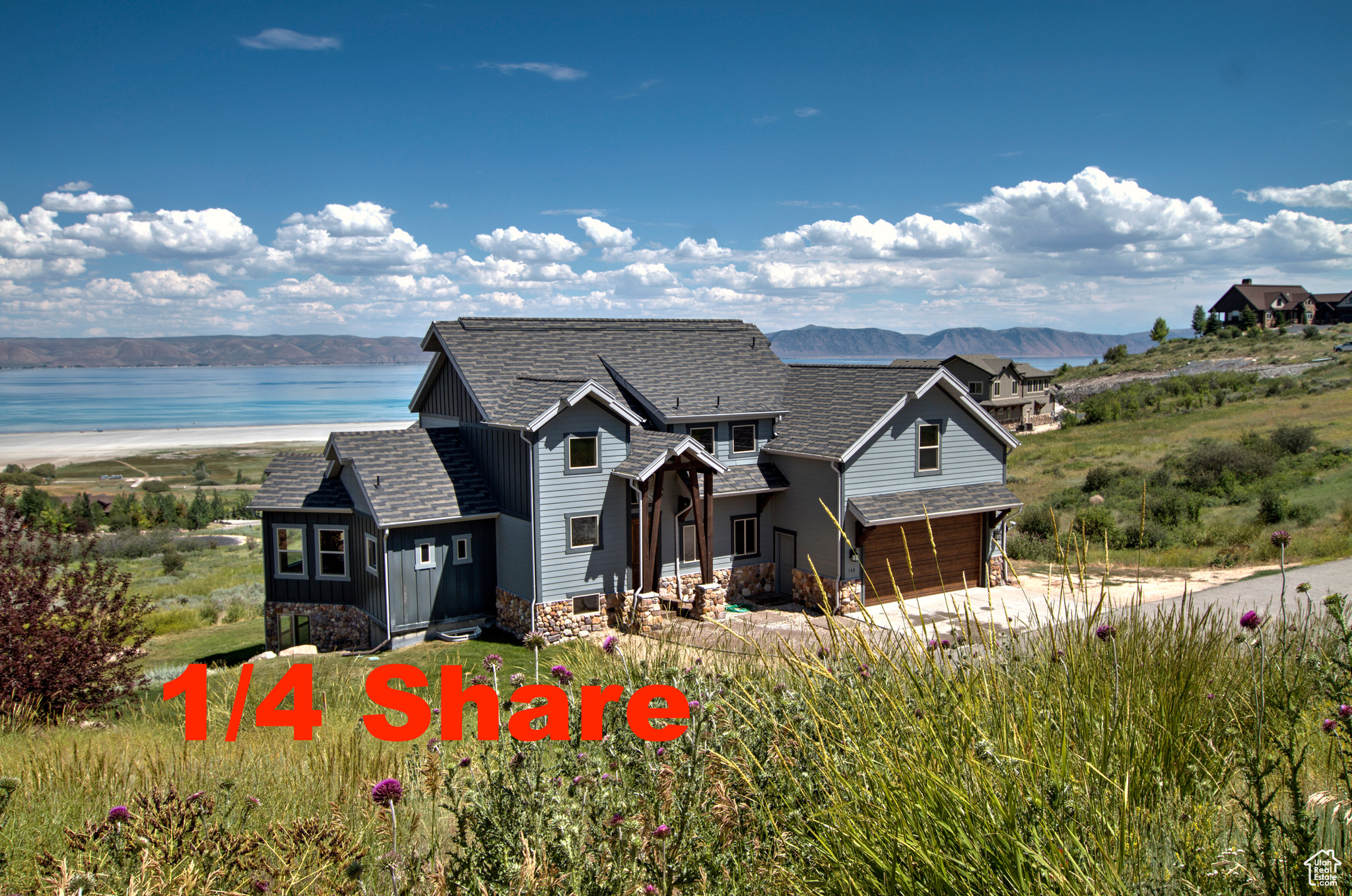 View of front of home with a water and mountain view