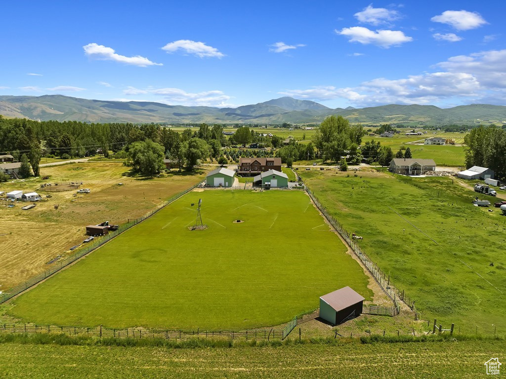 Birds eye view of property with a rural view and a mountain view