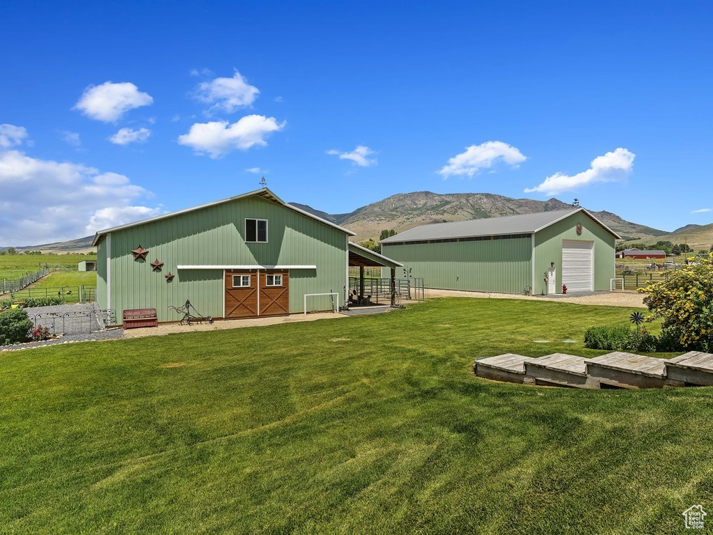 Exterior space featuring an outdoor structure and a mountain view