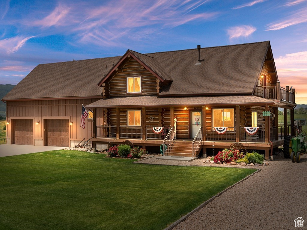 Cabin with a yard, a balcony, and a porch