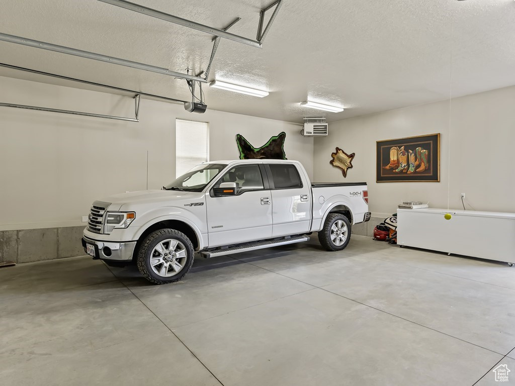 Garage featuring a garage door opener