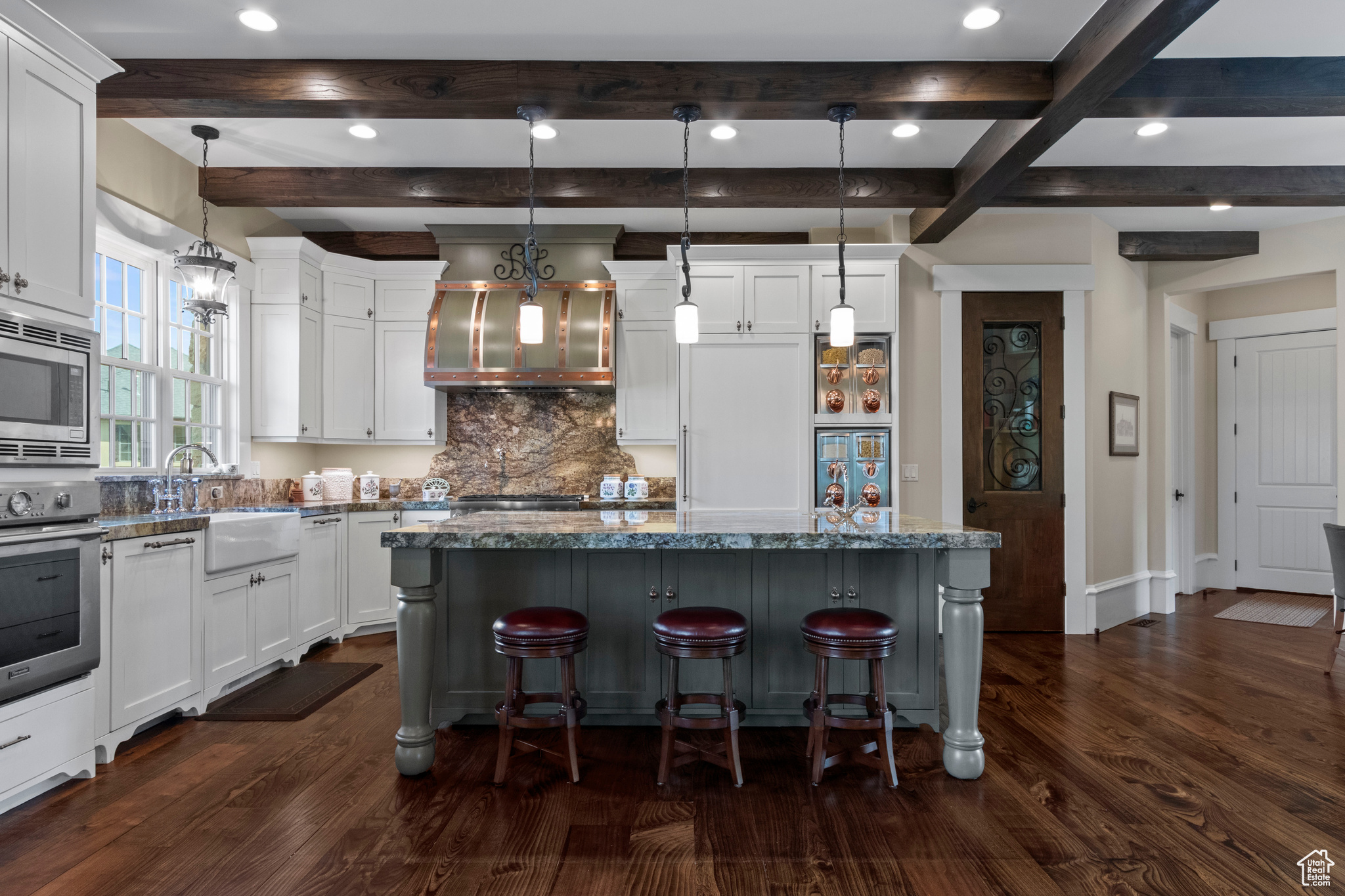 Kitchen featuring pendant lighting and a kitchen bar
