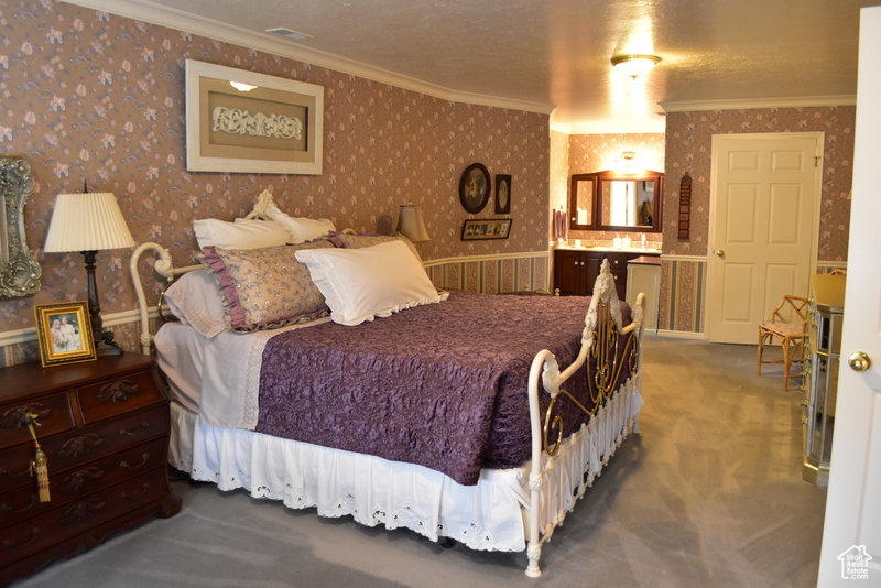 Master Bedroom featuring ornamental molding and dark carpet