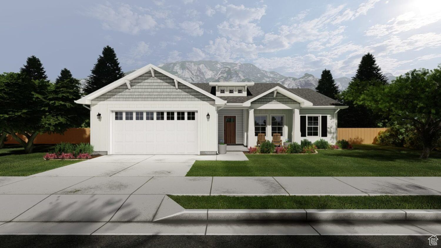 Craftsman inspired home with a garage, a front yard, and a mountain view