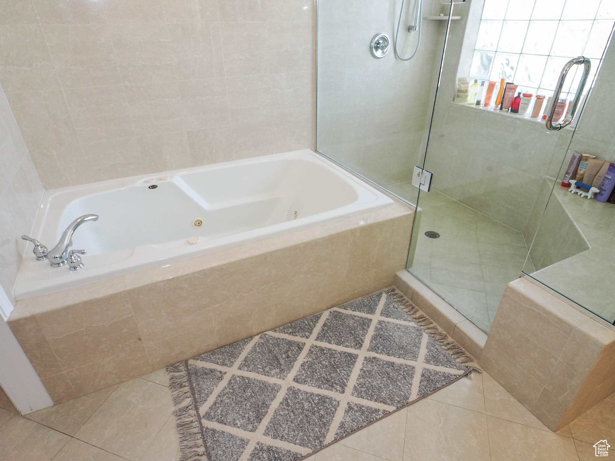 Primary Suite Bathroom with separate glass enclosed shower