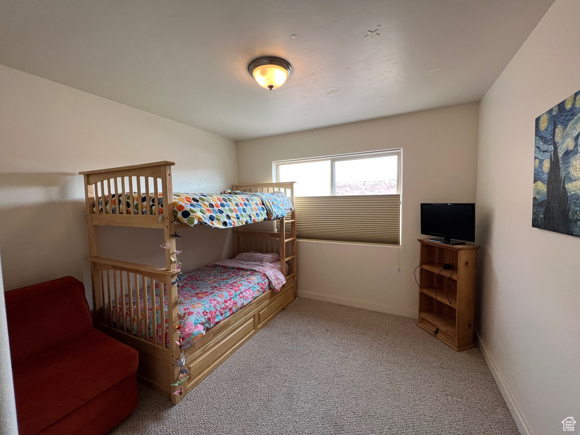 https://assets.utahrealestate.com/photos/280x210/1977729_42085e0a59be00b734a8bb03d2dec1f2_65bc20f29ac0d.jpgBedroom with light carpet.  Bunk beds!