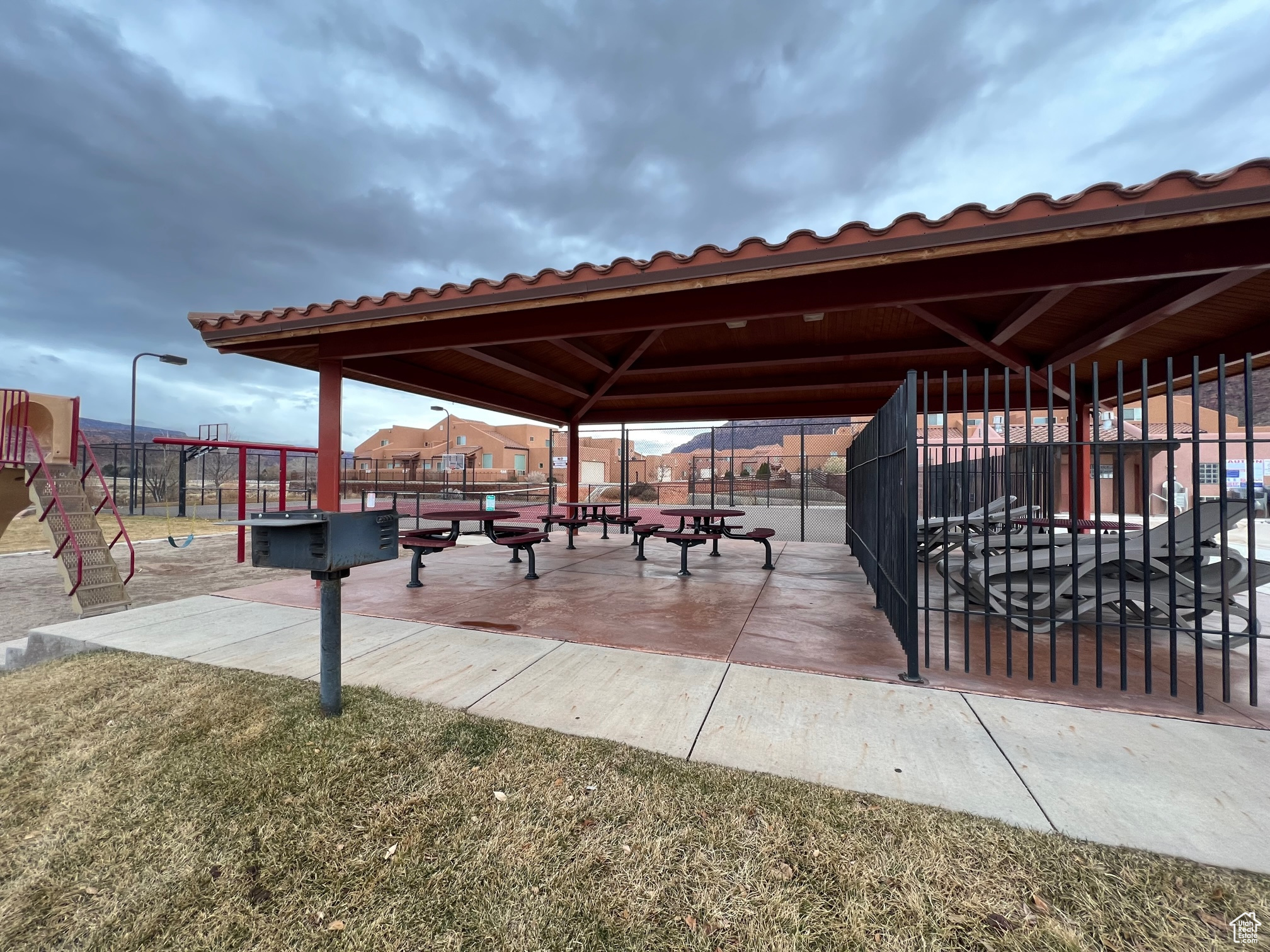 View of property's community bbq featuring a gazebo and a lawn