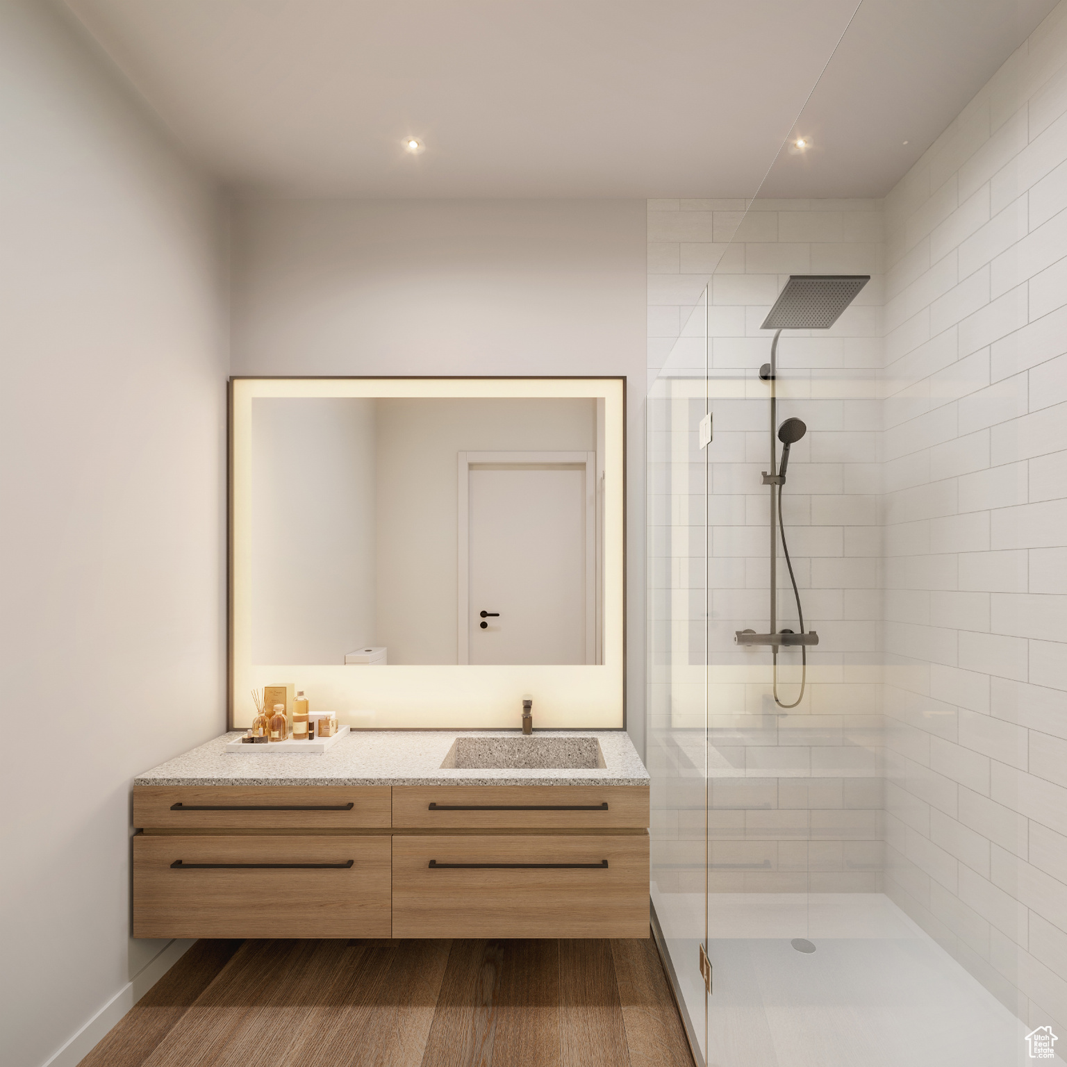 Bathroom with vanity, hardwood / wood-style floors, and a shower with door