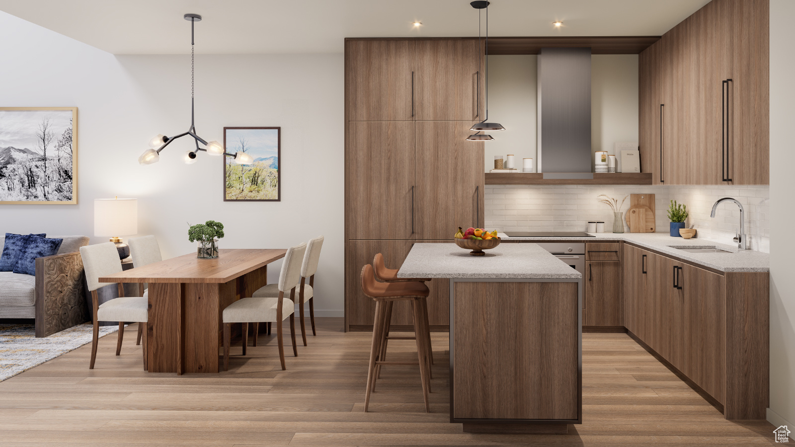 Kitchen featuring a breakfast bar, pendant lighting, light hardwood / wood-style flooring, and a center island