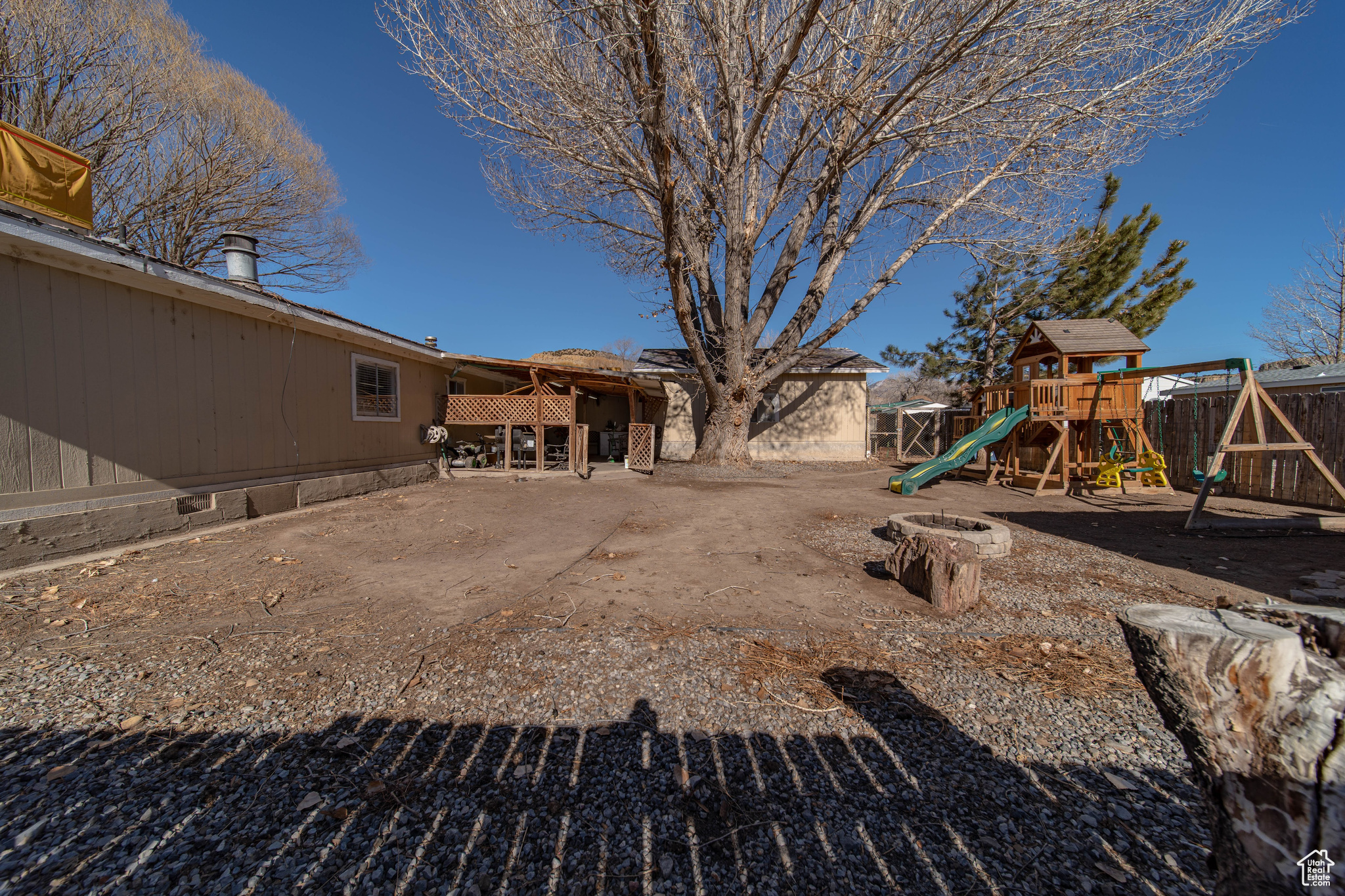 View of yard with a playground and a patio area