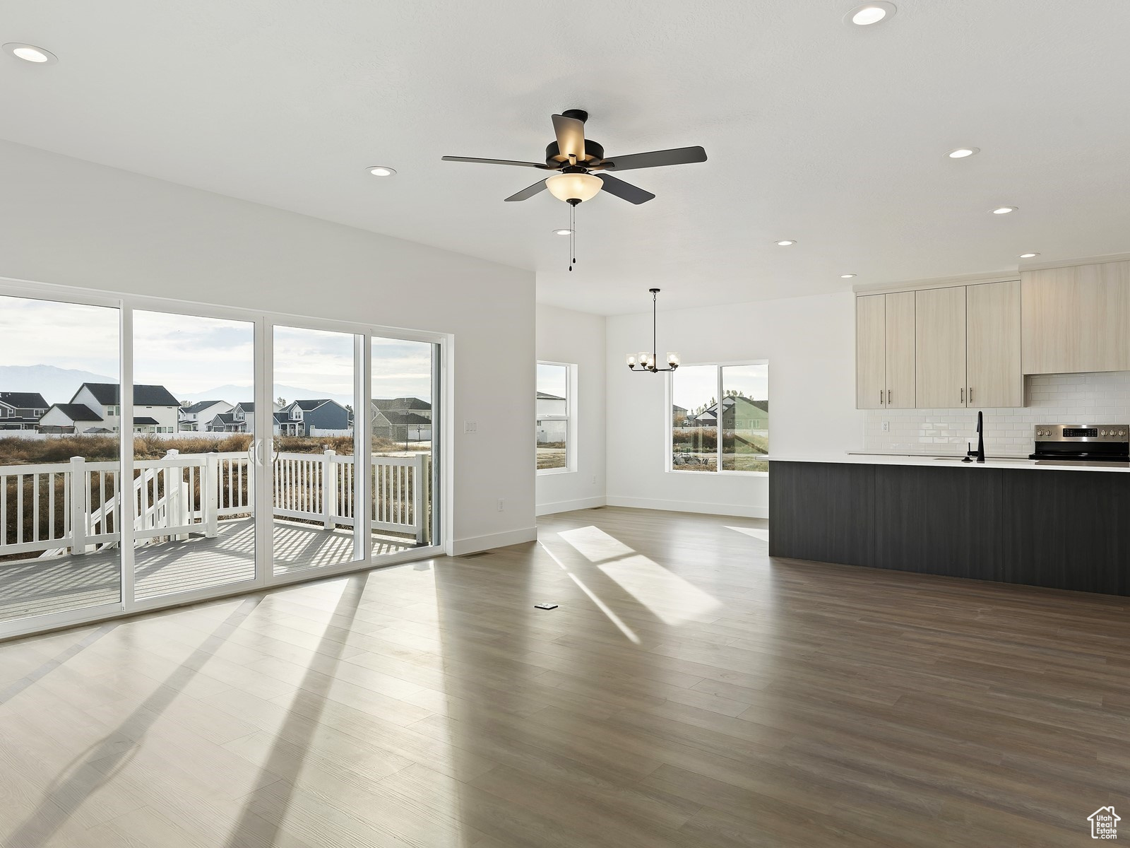 Open Concept Family Room with deck and kitchen in background