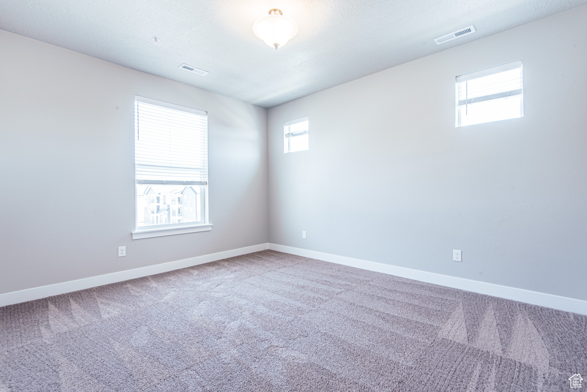 View of carpeted spare room