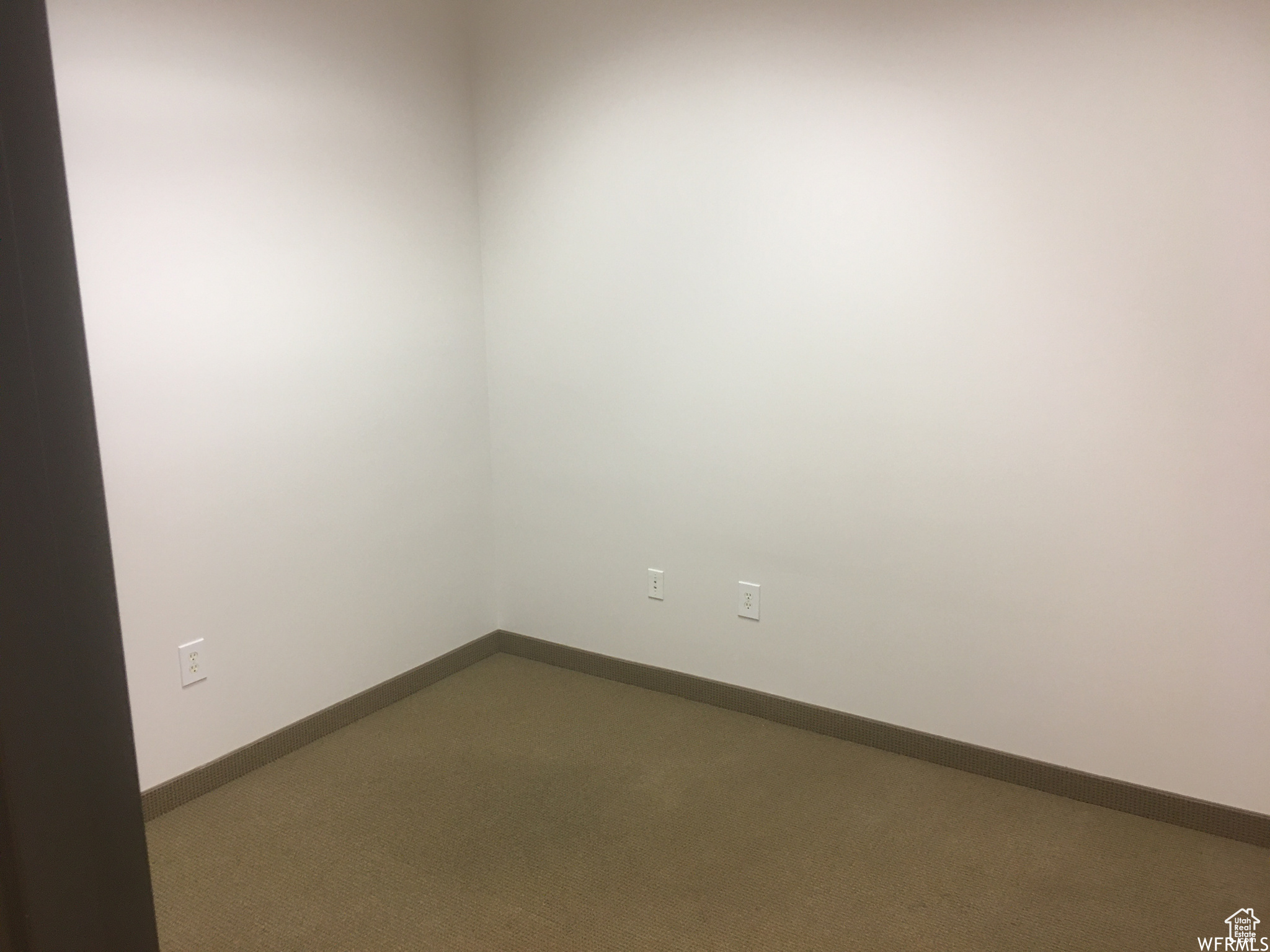 Unfurnished room with carpet floors