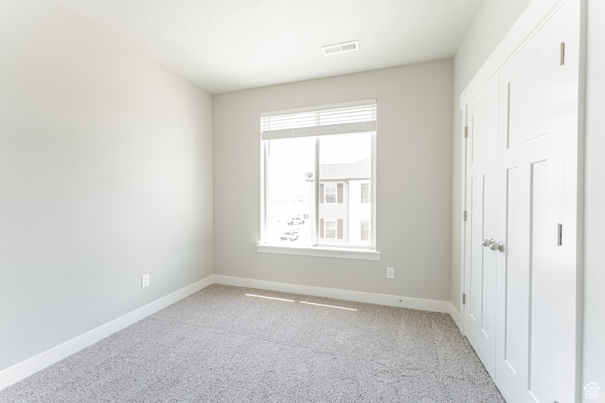 Unfurnished bedroom with carpet floors