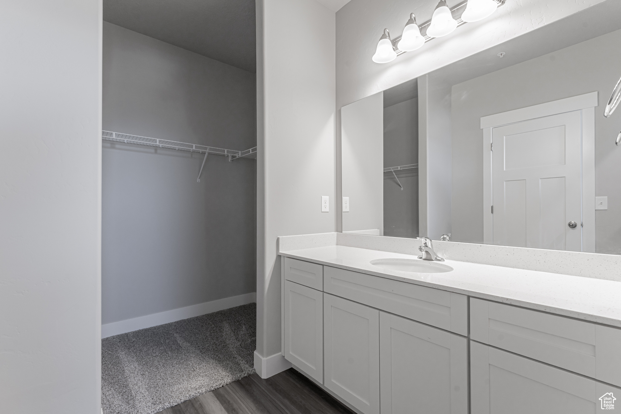 Bathroom featuring vanity and hardwood / wood-style floors