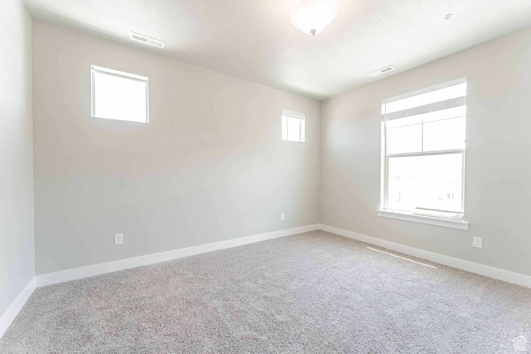 Empty room featuring carpet floors