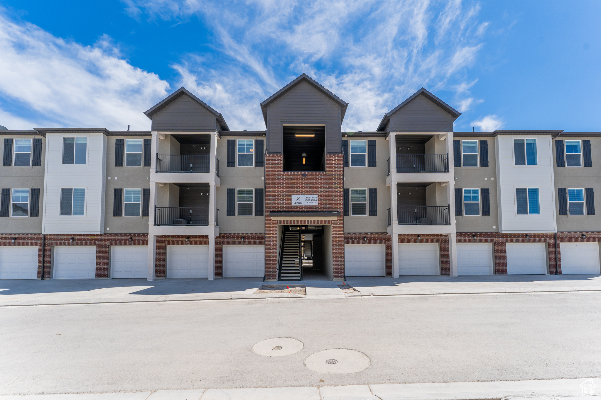 View of building exterior featuring a garage