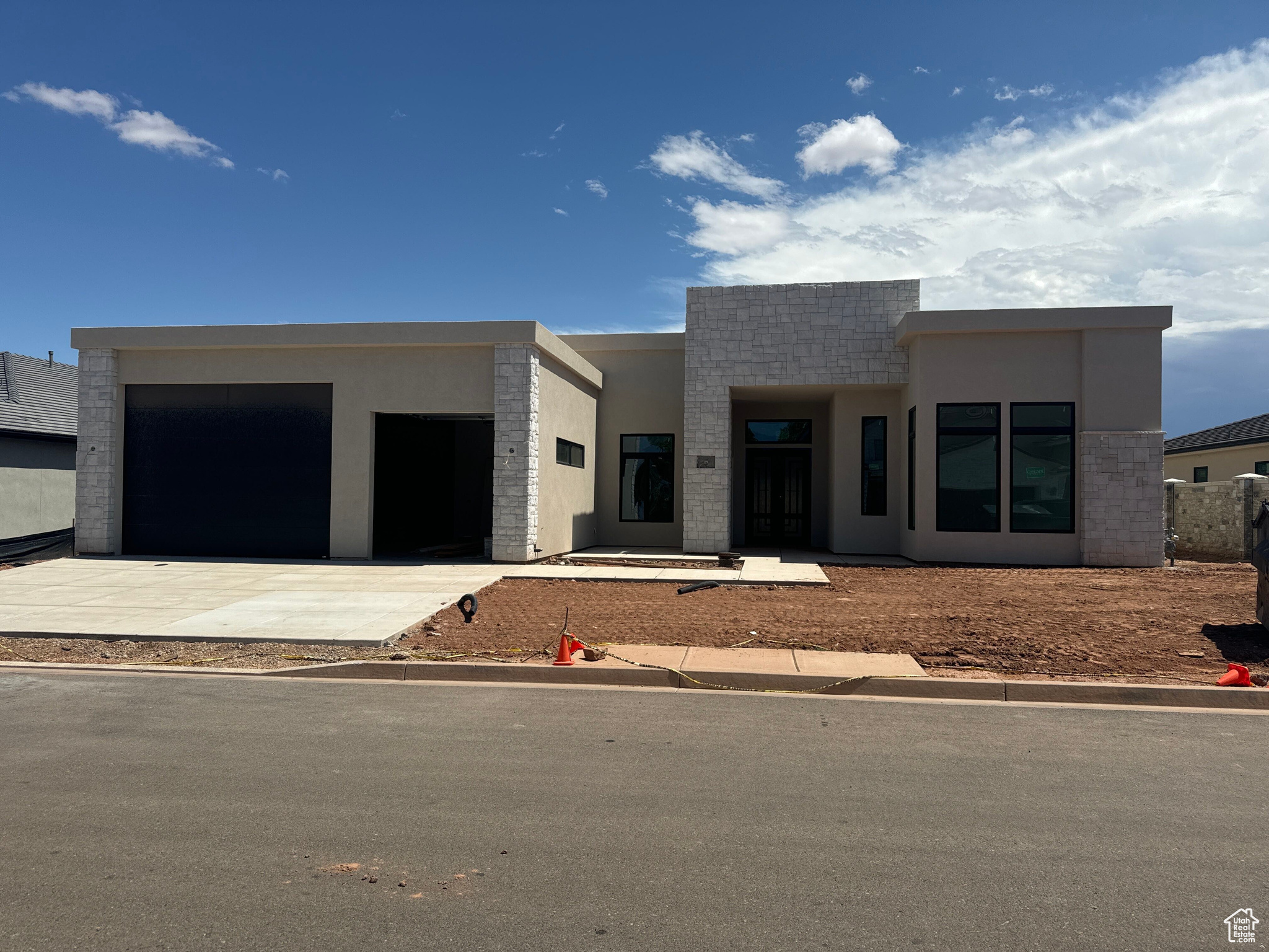 View of front facade featuring a garage