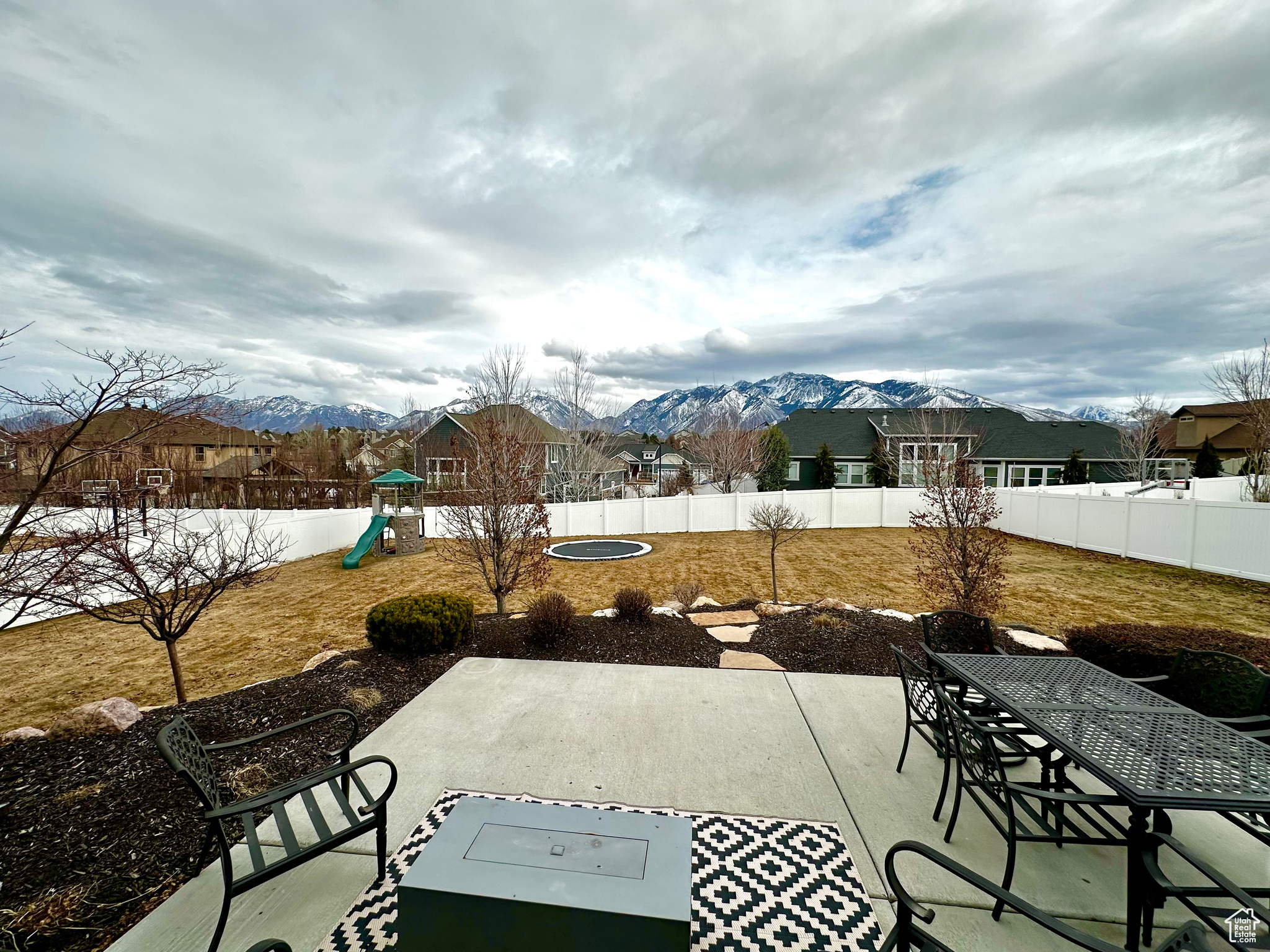 View of patio / terrace with a mountain view and a playground