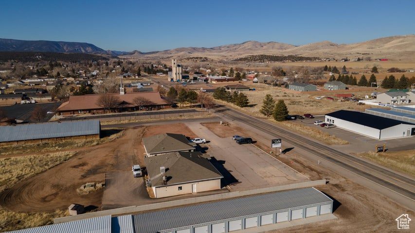 Birds eye view of property with a mountain view