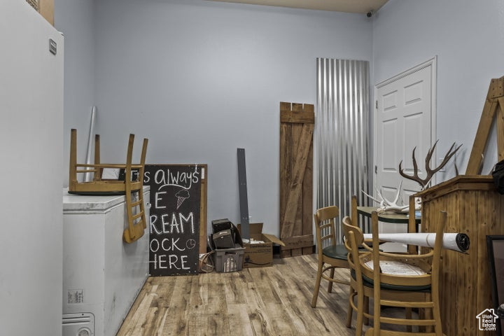 Office area featuring wood-type flooring