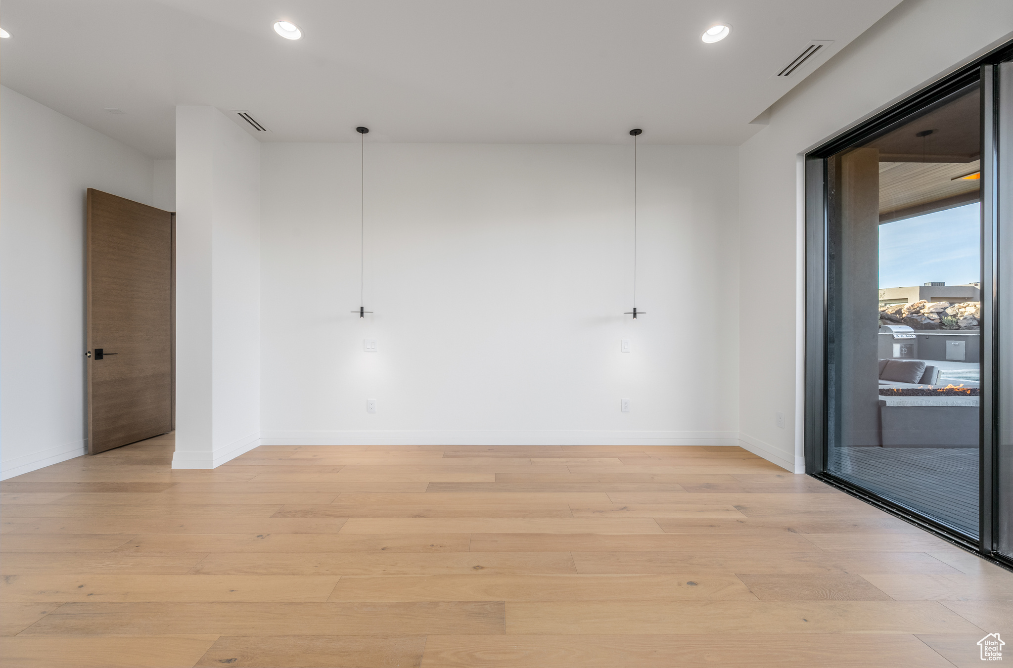 Empty room featuring light hardwood / wood-style flooring