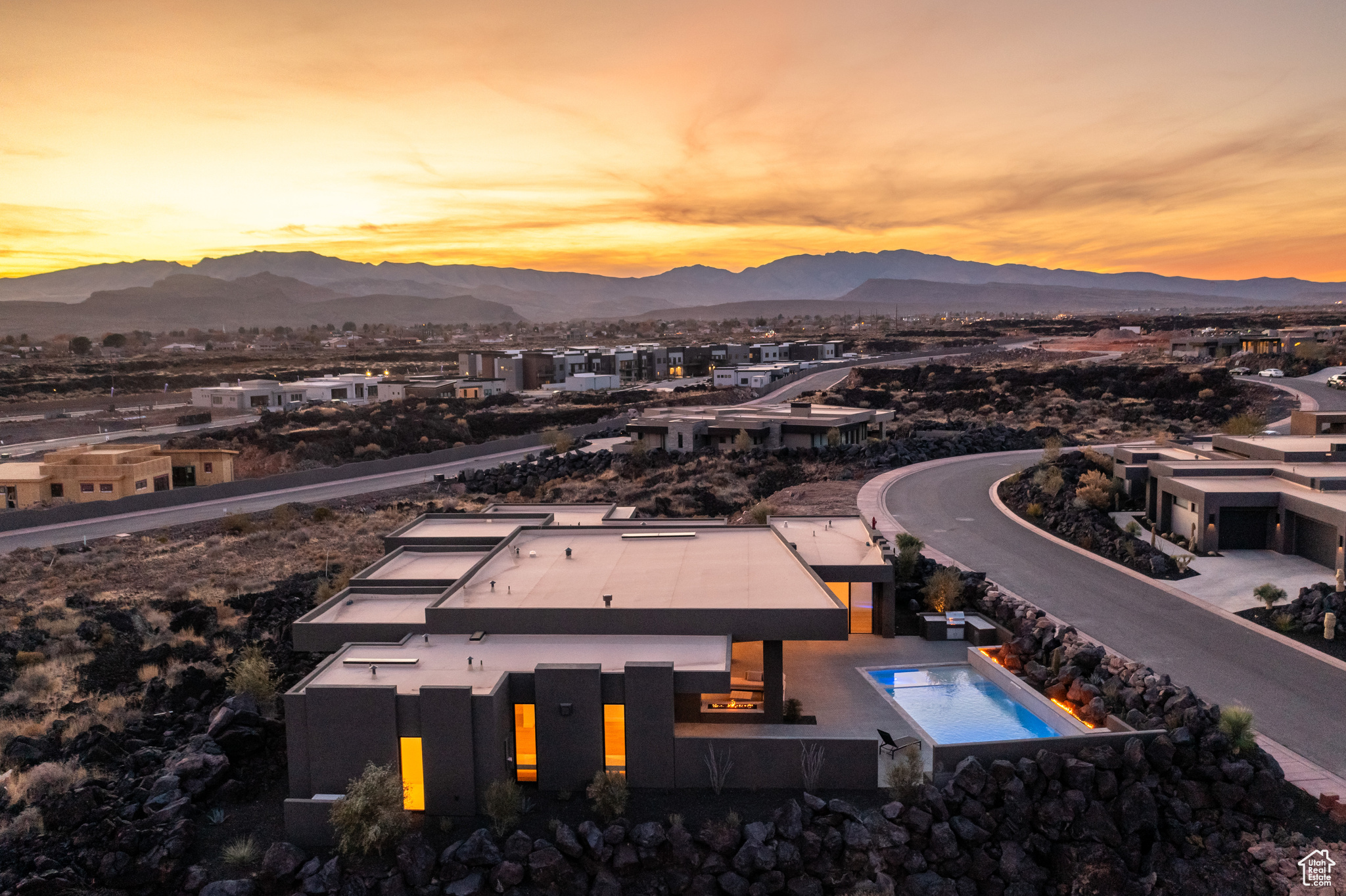 Aerial view at dusk featuring a mountain view