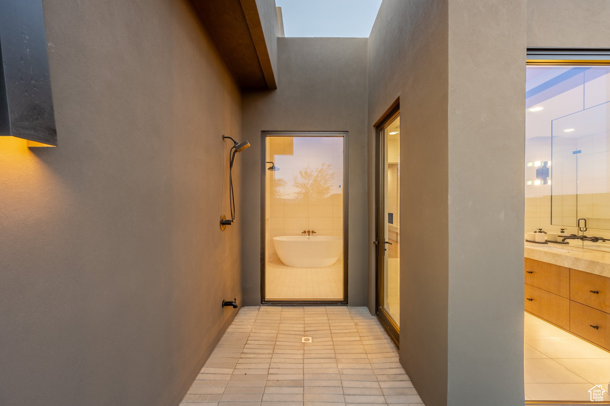 Corridor featuring light tile patterned flooring