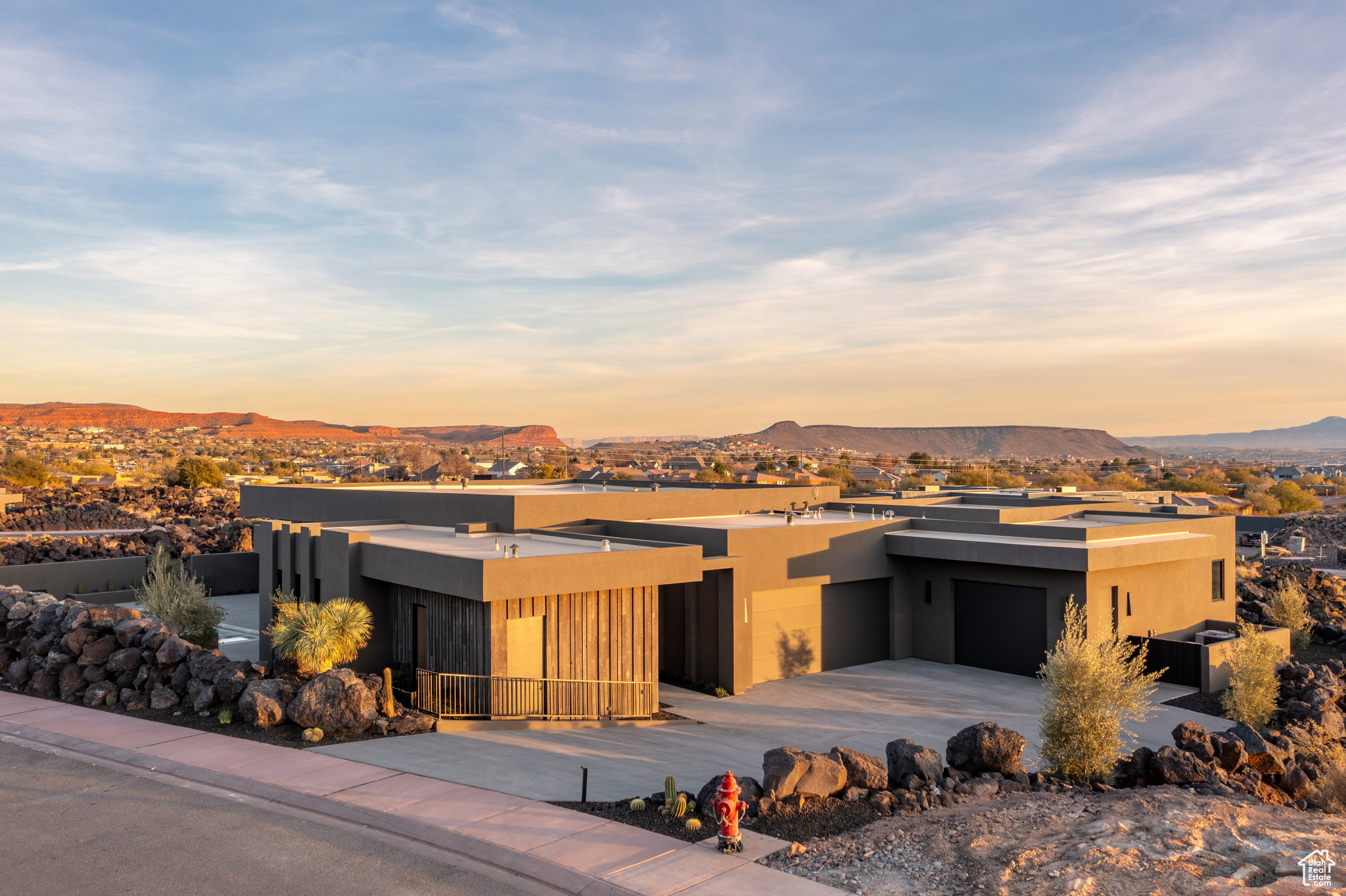 View of front facade with a mountain view and a garage