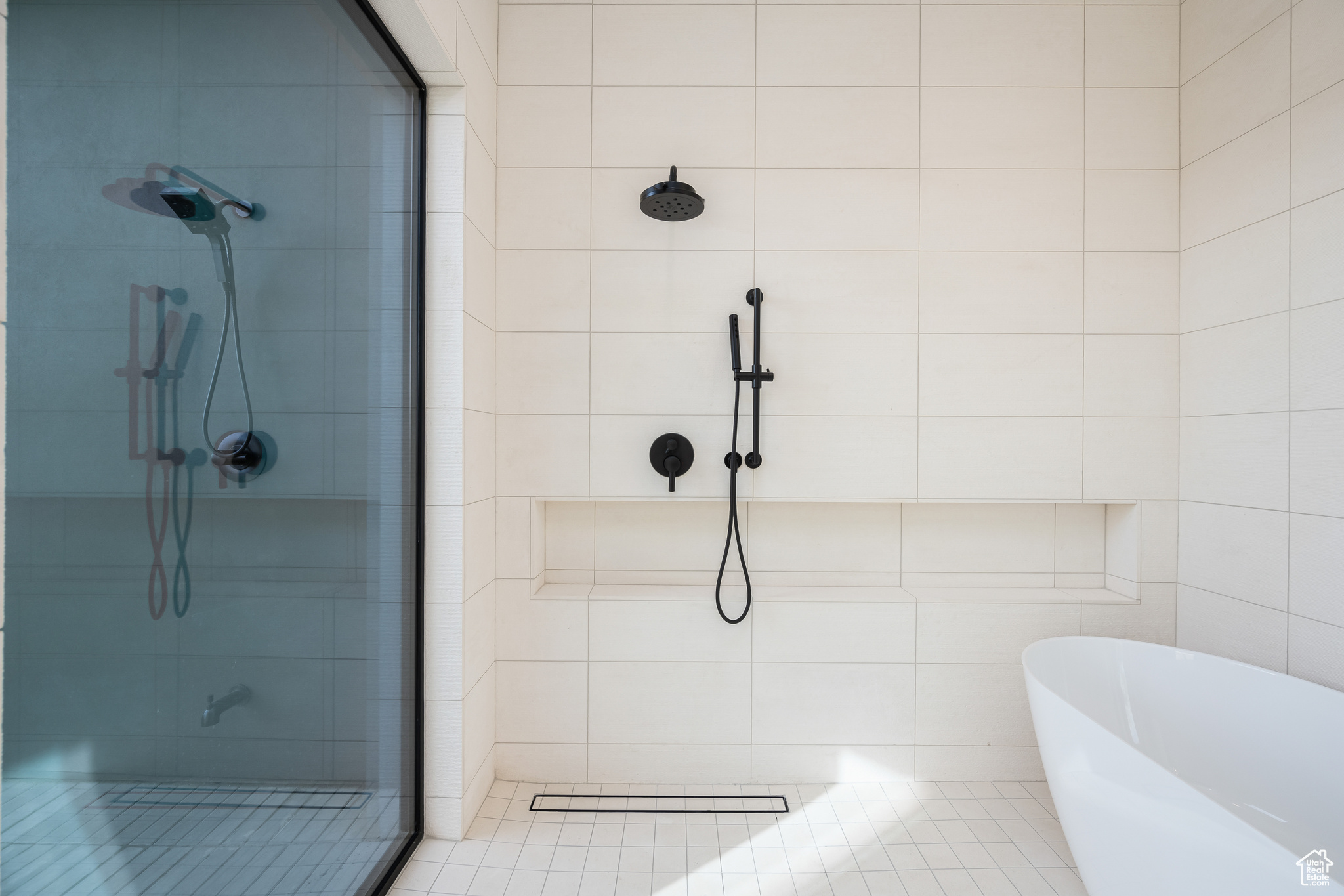 Bathroom with tile patterned floors and plus walk in shower