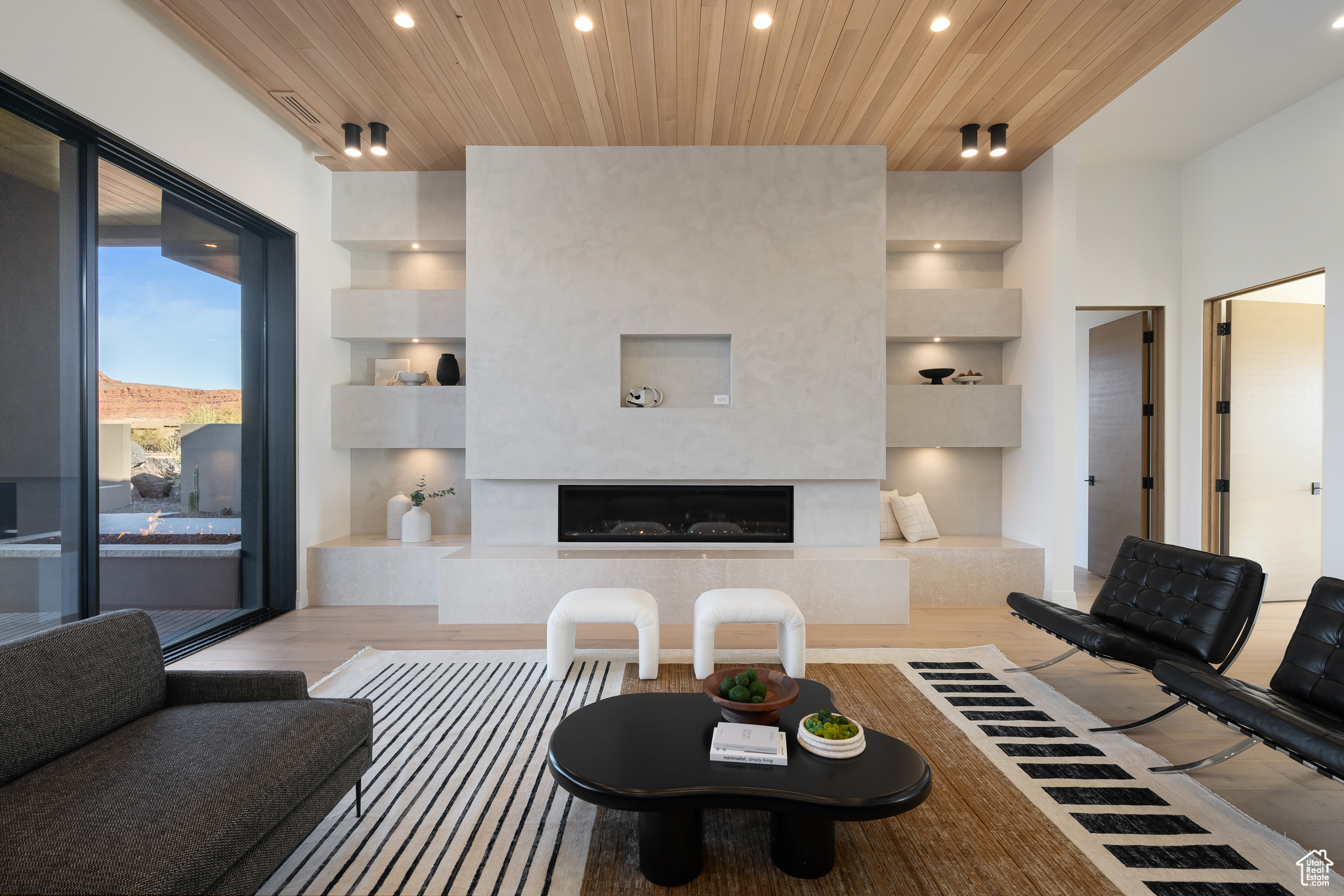 Living room with light hardwood / wood-style floors and wood ceiling