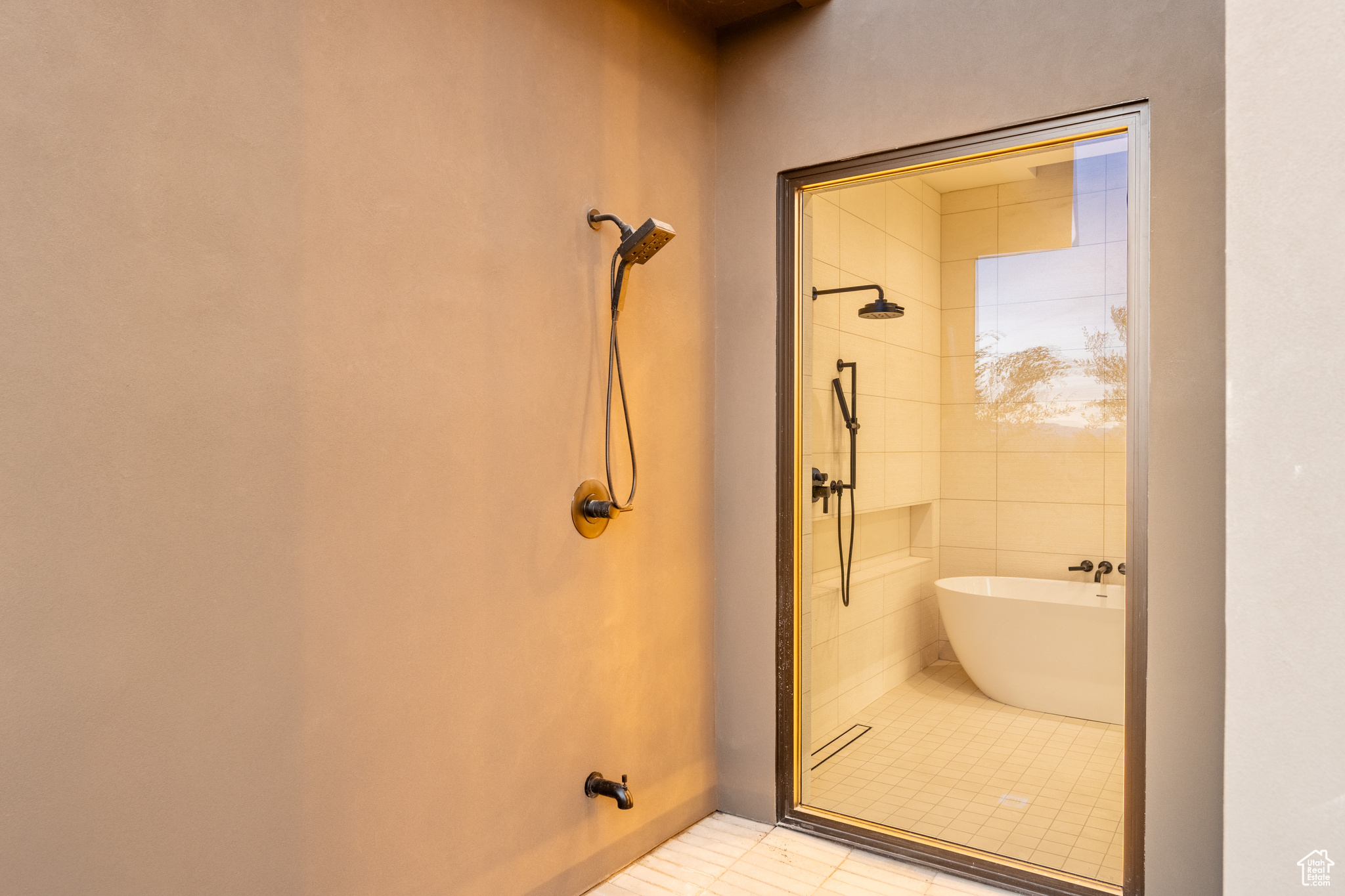 Bathroom with tile patterned floors and independent shower and bath