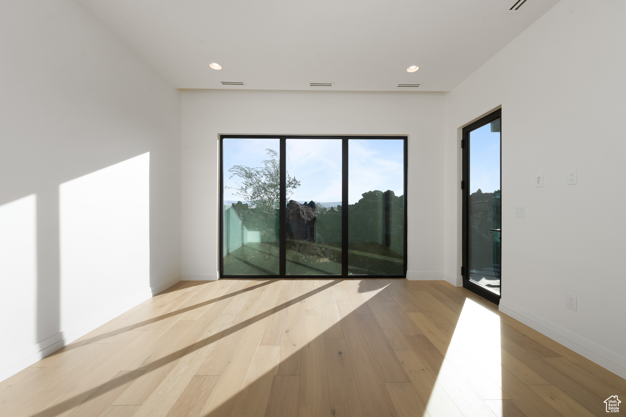 Spare room with light hardwood / wood-style floors