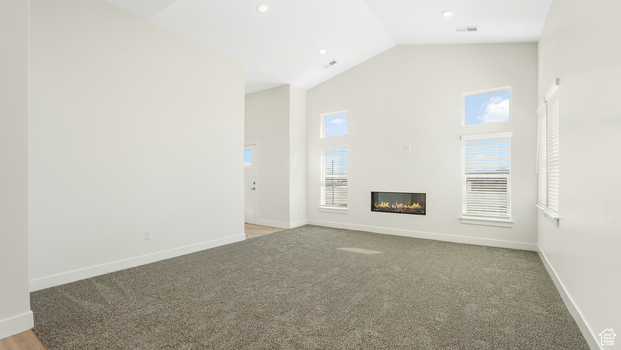 Great room with vaulted ceilings and fireplace.