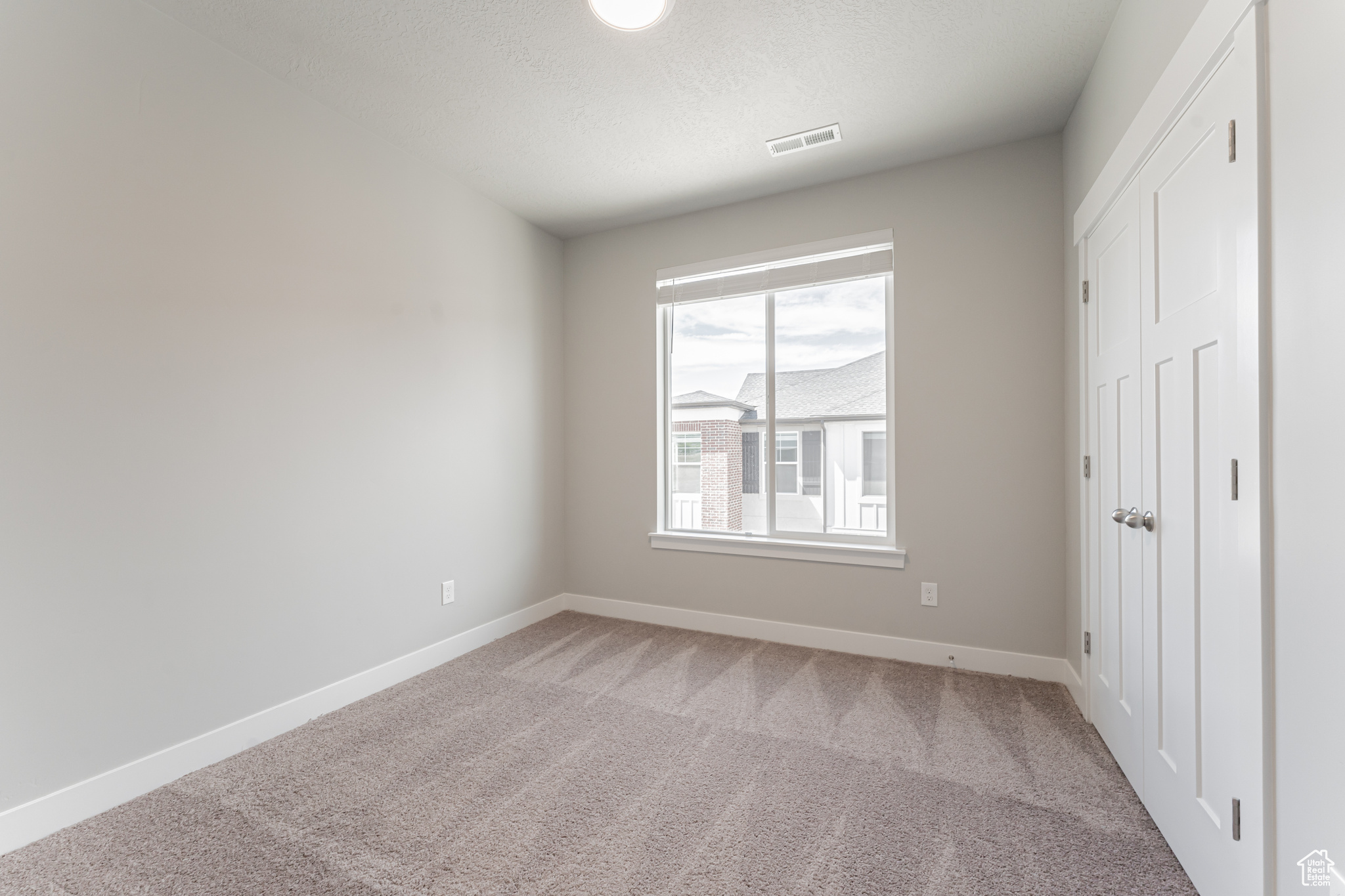 Unfurnished bedroom featuring carpet flooring