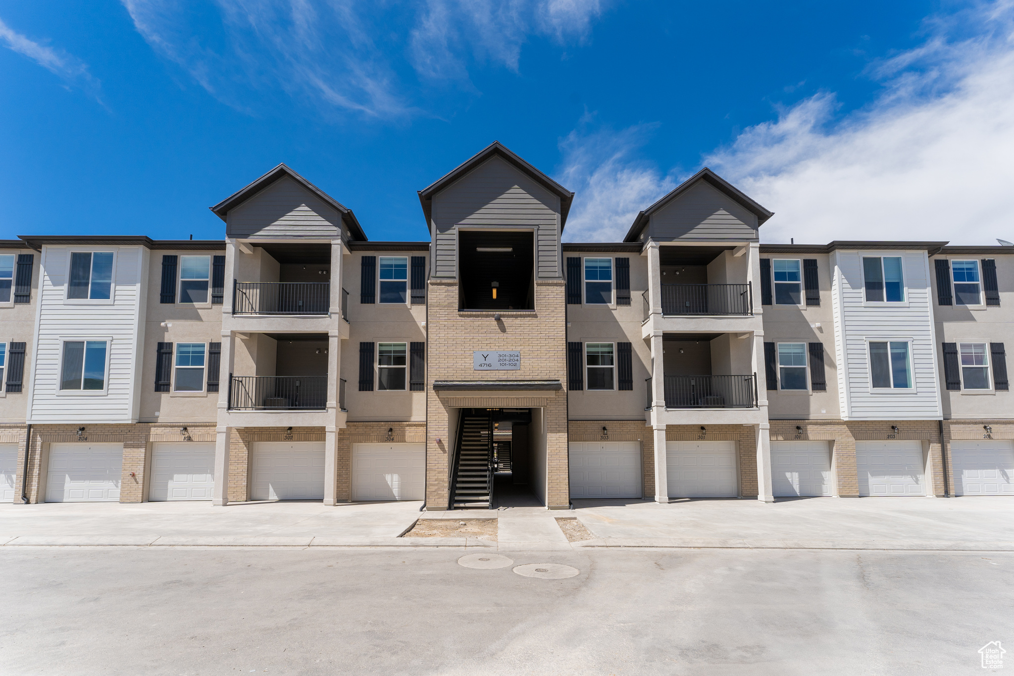 View of building exterior with a garage