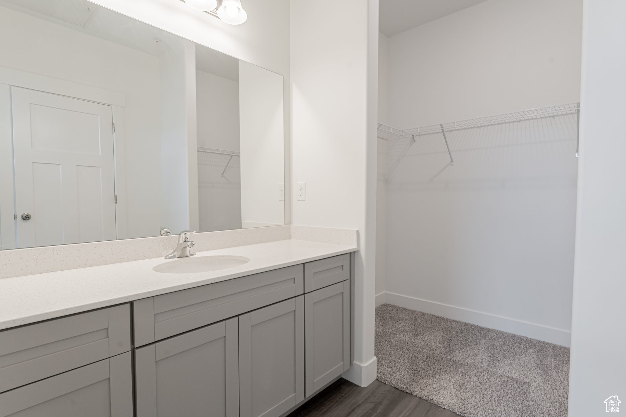 Bathroom with vanity and hardwood / wood-style floors