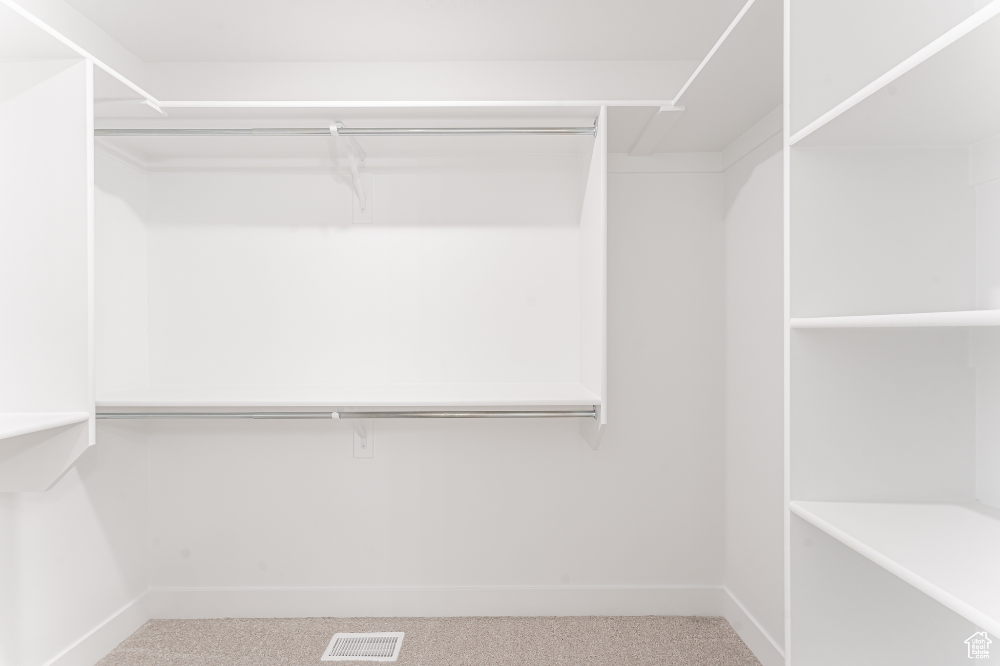 Spacious closet featuring carpet