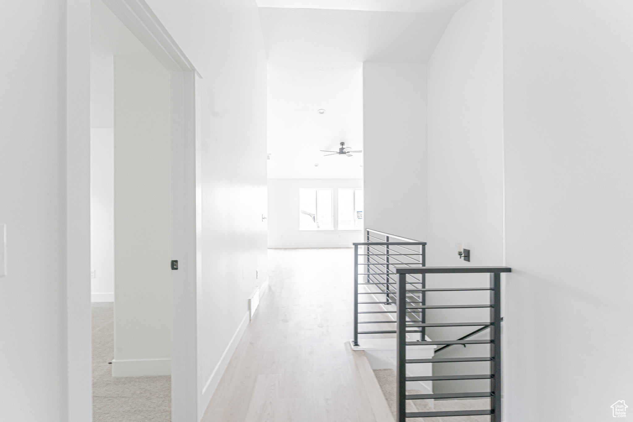 Corridor with light wood-type flooring