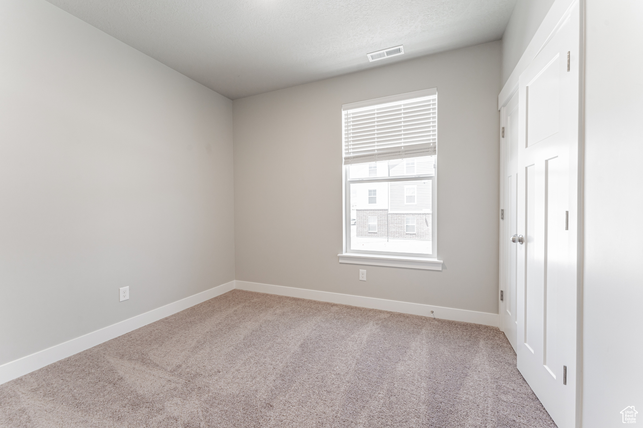 Empty room featuring carpet