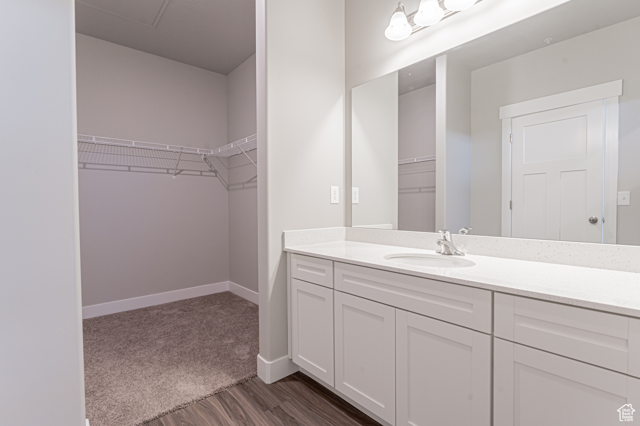 Bathroom featuring vanity and hardwood / wood-style flooring