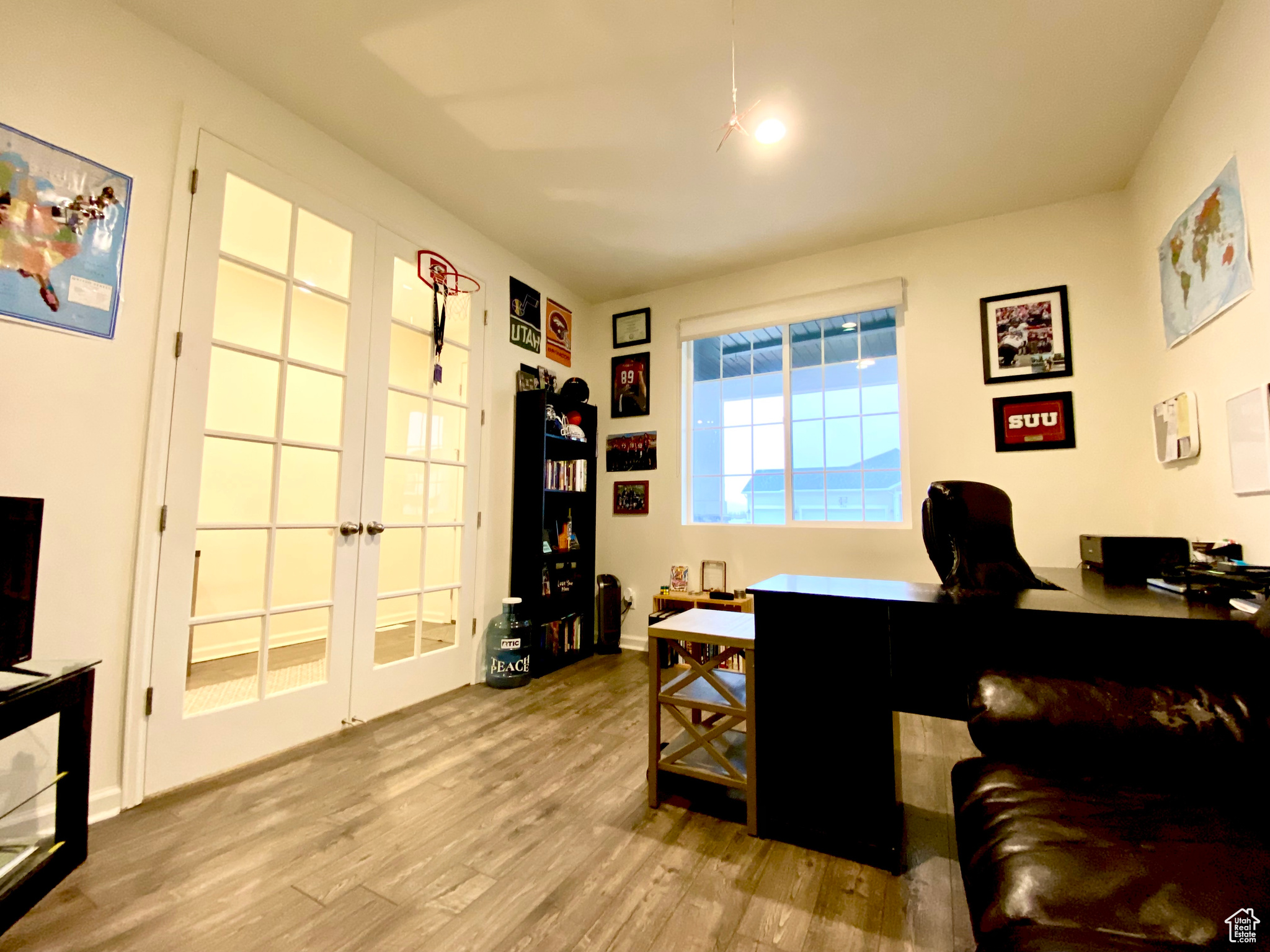 Office area featuring light hardwood / wood-style flooring and french doors