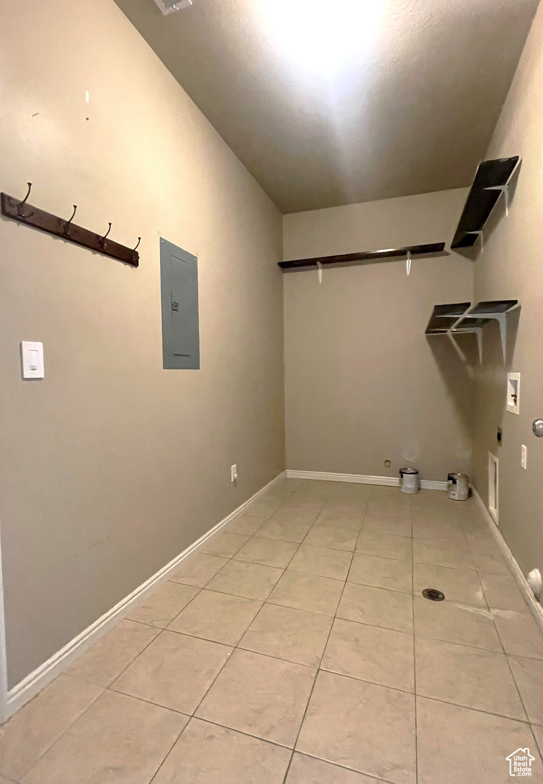 Laundry room with shelving
