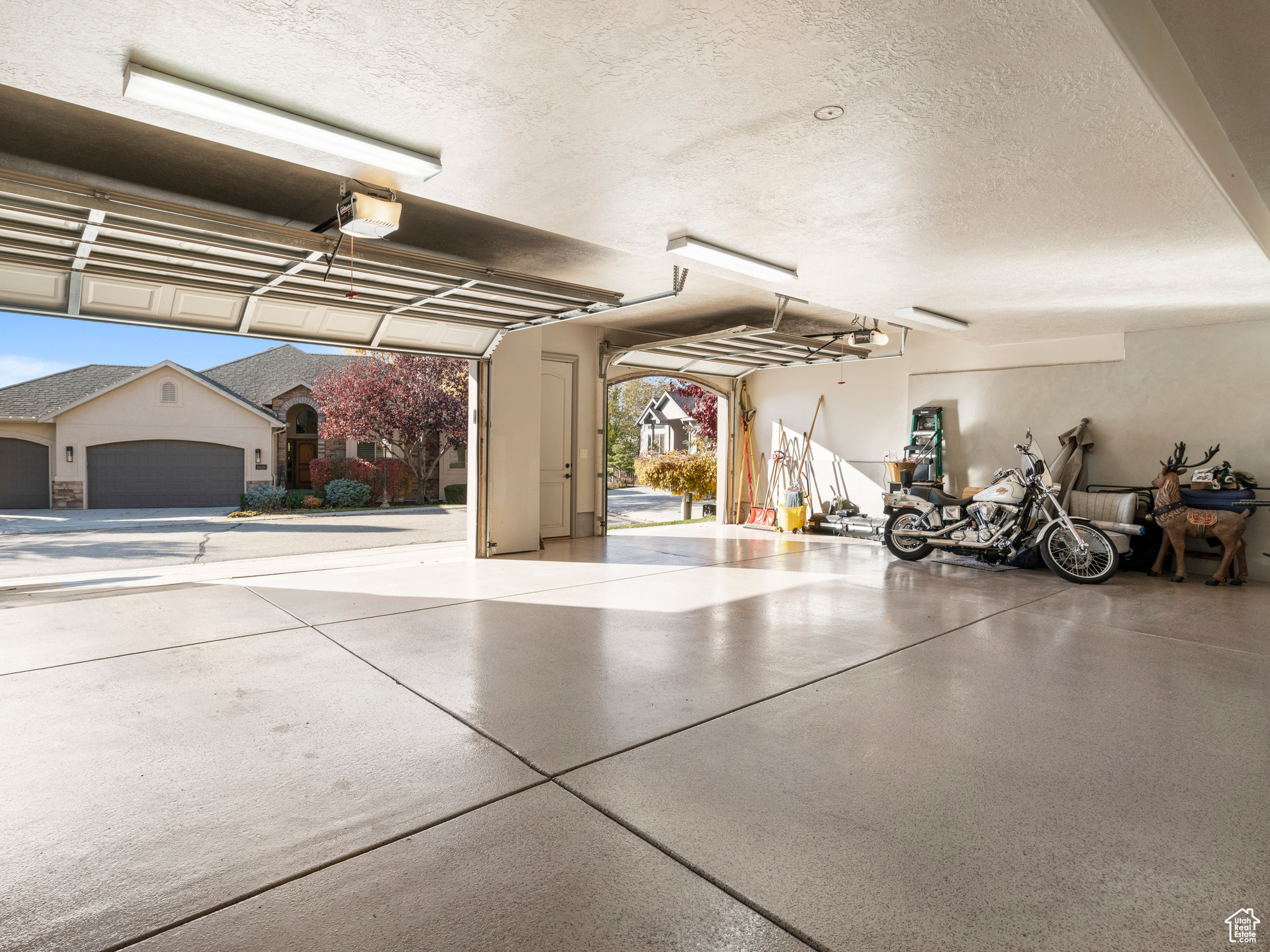 Oversized 3 car Garage with epoxy floors, and garage door opener