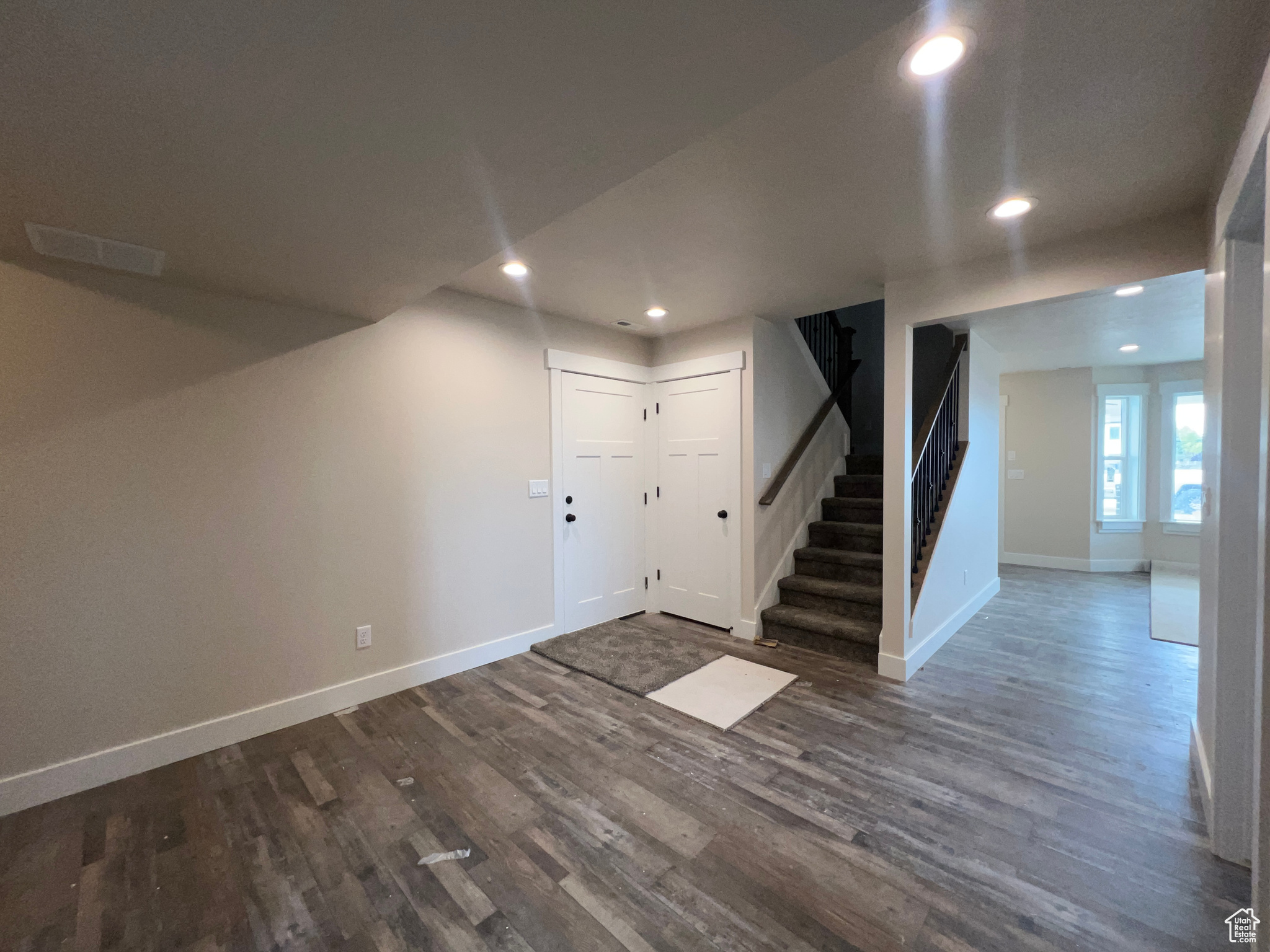 Basement featuring dark hardwood / wood-style floors
