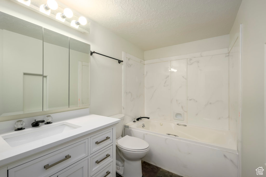 Full bathroom with vanity, shower / bathing tub combination, mirror, and toilet