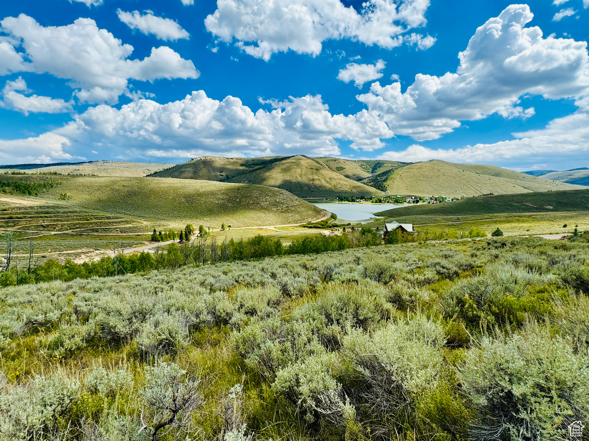 View of mountain feature with a water view and a rural view