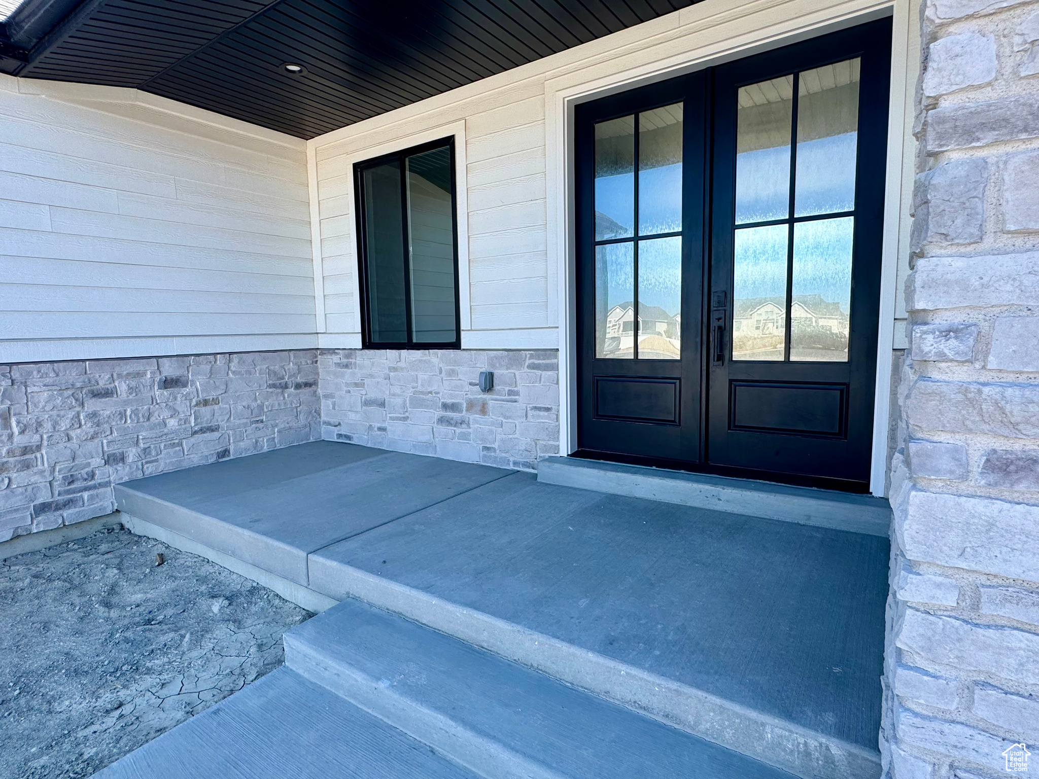 Property entrance with french doors