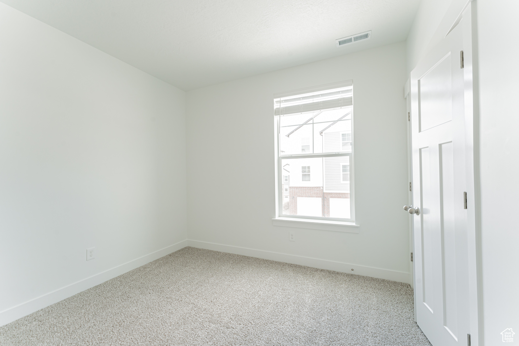 Unfurnished room featuring carpet floors